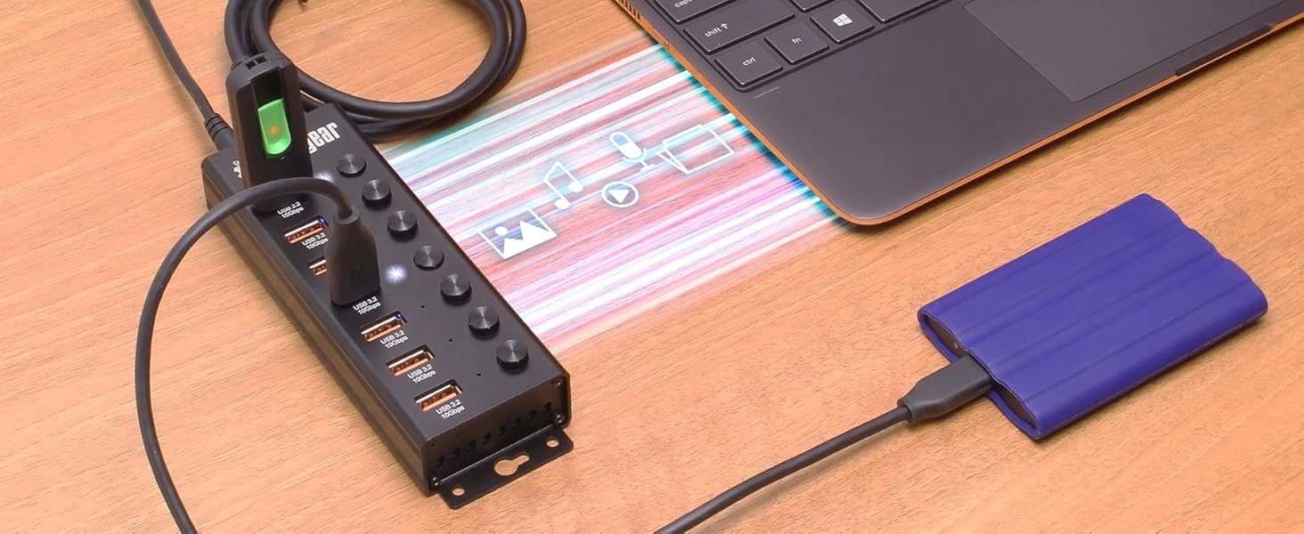 USB hub plugged into a laptop transferring files