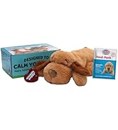 Text reads "DESIGNED TO CALM YO" and "Heat Pack". Plush brown puppy toy with closed eyes, red heart-shaped object, and blue box containing a heat pack for soothing pets.