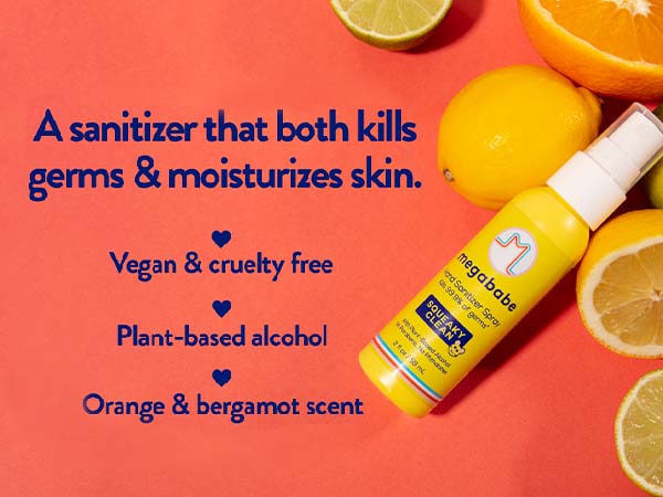 Hand sanitizer 2 oz spray on red background next to lemons and limes.