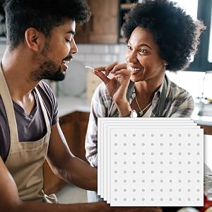 couple sharing food next to toaster oven paper liners