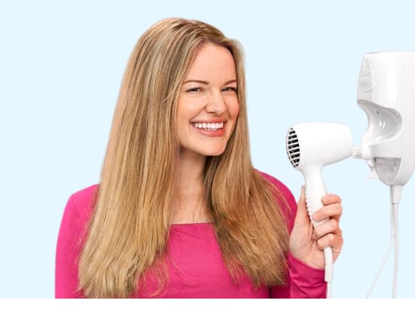 Woman with wall mounted dryer