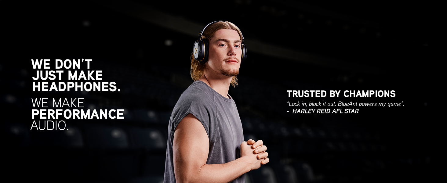 Harley Reid stands in a stadium wearing Pump X headphones, exuding focus and confidence.