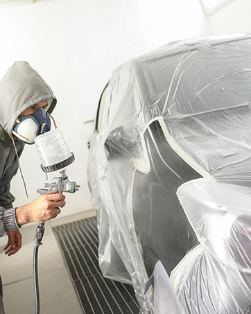 Clear plastic drop cloths ensure visibility while paint cover plastic dries.