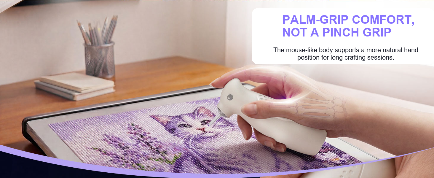 A hand uses the Ulverion electric diamond painting pen with a palm-grip design.