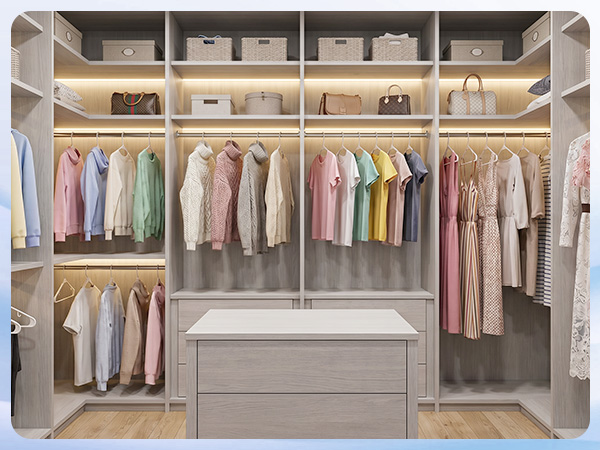 Open closet with white hangers holding shirts, jackets, and pants. Sleek uniform look