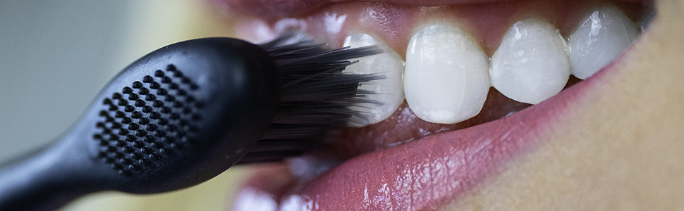 Close up of brushing teeth long tapered Bristles Bamboo Charcoal EZZI
