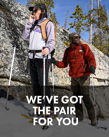 Two people taking a break while snow shoeing