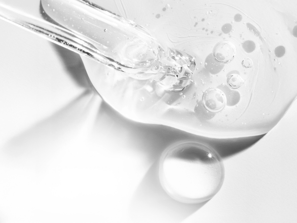 Liquid product & a dropper on a white background.