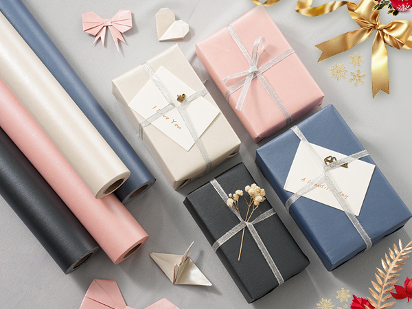 a collection of gift wrapped presents on a table.