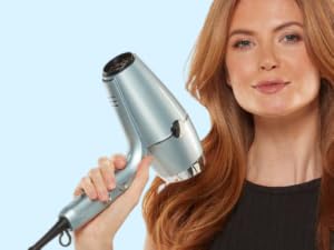 Woman with hair dryer