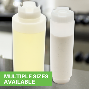 A 16-ounce condiment bottle and 32-ounce dressing dispenser displayed on a table.