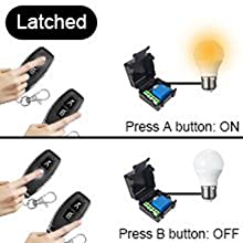 a hand holding a cell phone and a light bulb