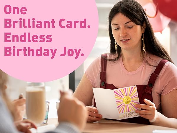 sealed birthday card with pink envelope and confetti celebration flat-lay