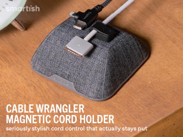 Cable Wrangler magnetic cord holder on wood desk holding USB-C and Lightning cables within reach