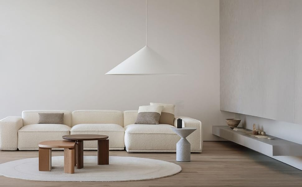 A bottle casting soft diagonal shadows on a clean surface with minimal natural lighting.