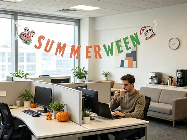 Paper banner brightens work cubicle for spooky summer fun.