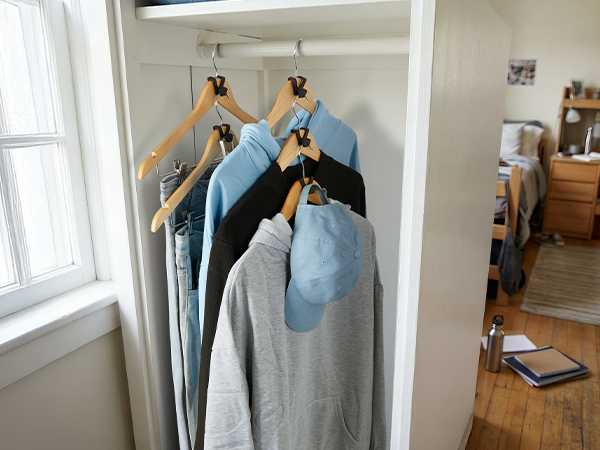 sorts garments by category neatly in dorm closets, partitions messy clothes clearly