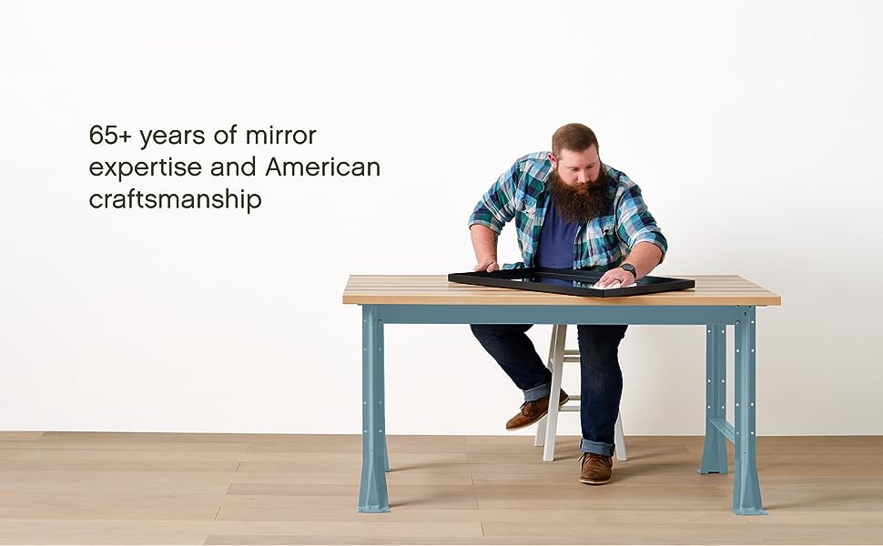 Guy Cleaning Mirror - 65+ years of mirror expertise and American craftsmanship