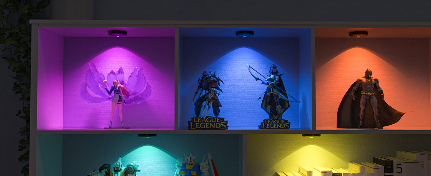Display shelves with colorful LED lighting. Five compartments showcase figurines in purple, blue, orange, teal, and yellow illumination.