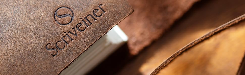 A brown leather journal embossed with the Scriveiner logo