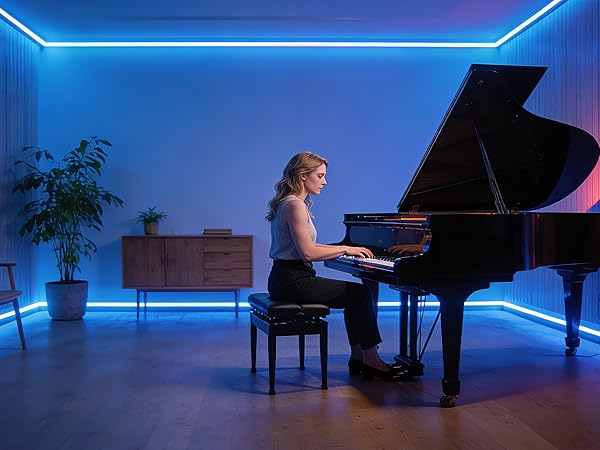 Grand piano performance scene in modern space with dramatic blue LED lighting strips along walls. Interior features potted plant and minimalist design.