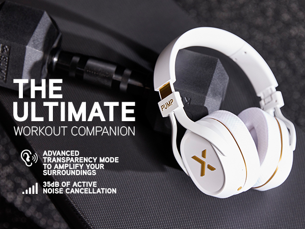 White Pump X headphones rest on a gym bench beside a dumbbell, symbolizing power, focus, and style