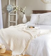 natural zig-zag throw blanket on bed