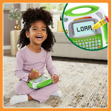 Happy kid writing her name, L O R A.