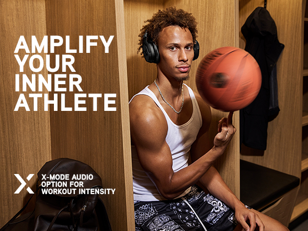 Dyson sits in locker room spinning a basketball on his finger while wearing black Pump X headphones