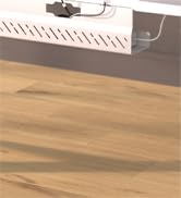 White electrical surge protector power strip with multiple outlets on a wooden surface. A gray power cord is plugged into one of the outlets.