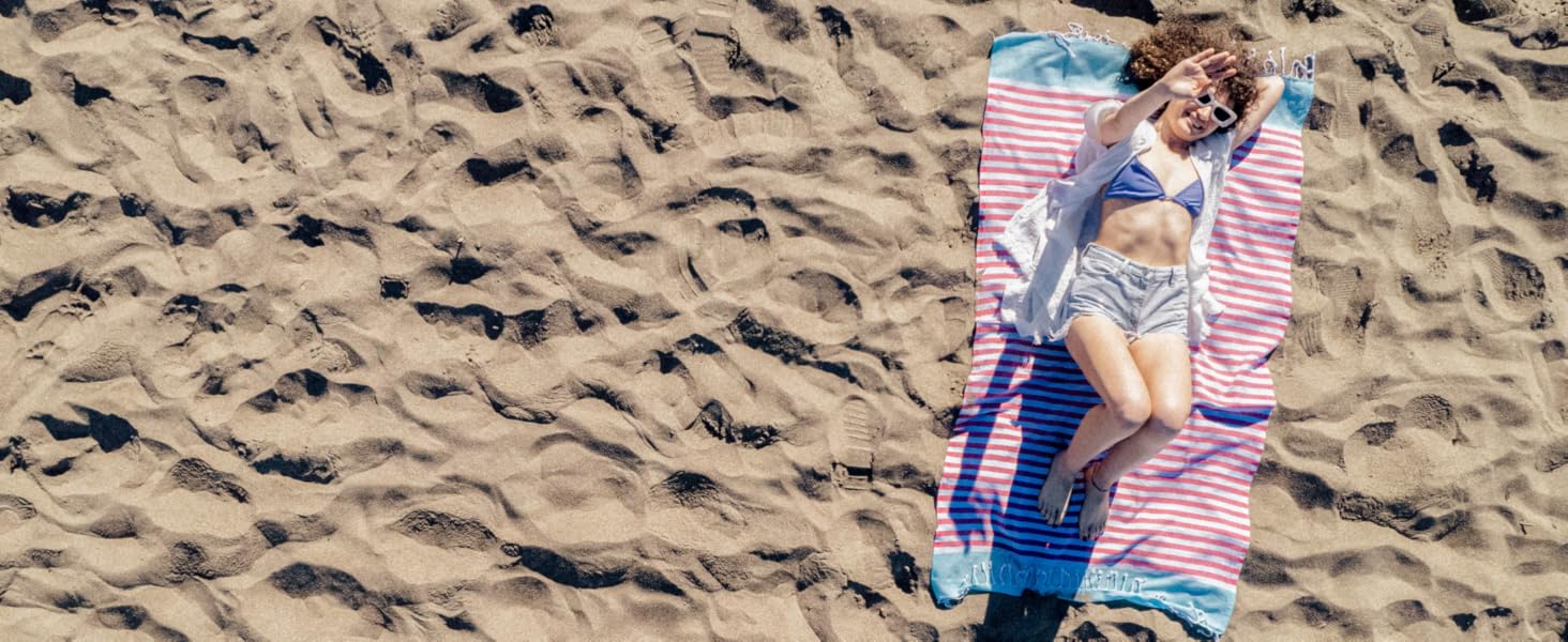 A Girl is Laying on the beach