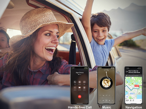 a woman driving a car with a child in the car and a cell phone in the front window.