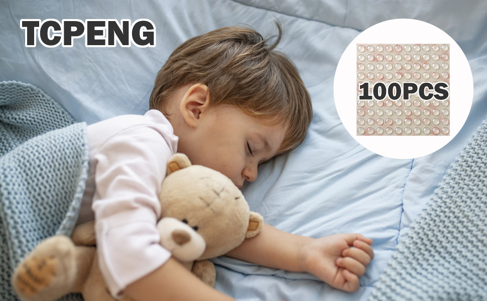 a little boy sleeping with a teddy bear