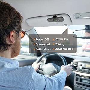 a man driving a car with a remote control.