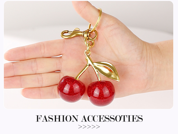 a pair of cherries in gold