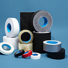 An array of tape refills and rolls you can use for any project stacked on a blue background
