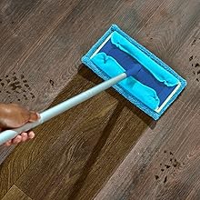 End-user cleaning hardwood floors with the microfibre sweeper pad designed for Swiffer Sweeper Mops