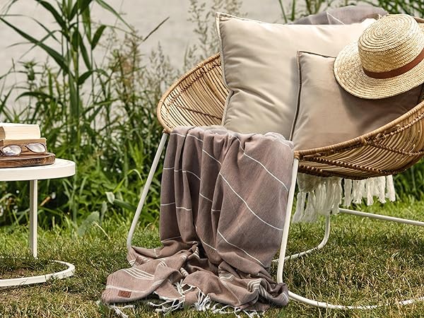 brown gold case turkish towel on a chair at the garden
