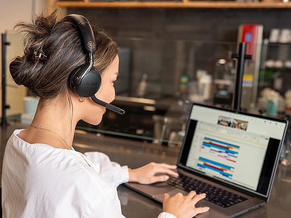 A woman taking a teams call with the go work 3 headset