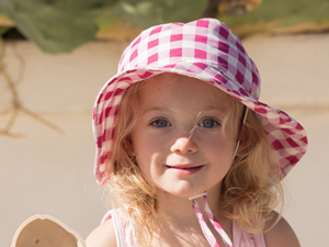 baby girl wearing brown checkers Tiny Twinkle Sun Hat