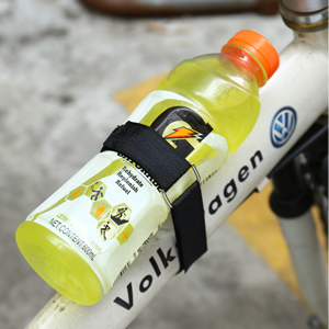 a bottle of carnaby drink on a bike