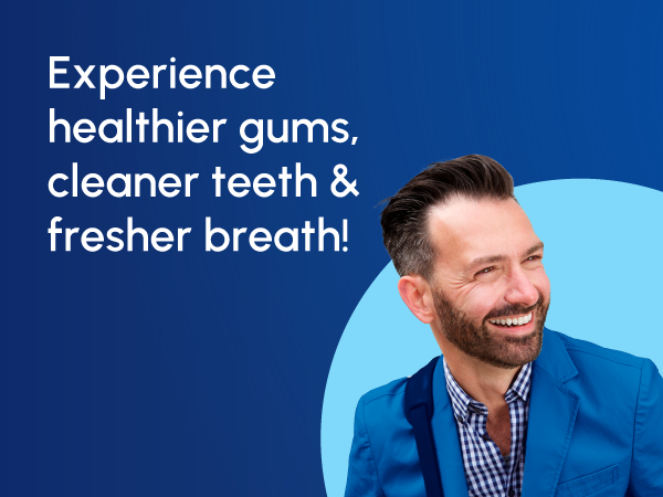 Image of smiling man with text reading experience healthier gums cleaner teeth and fresher breath.