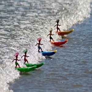 Surfer Dudes photograph of five surfer dudes catching a wave at the beach