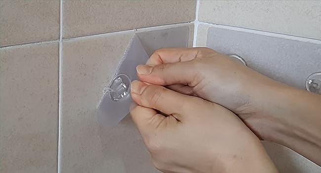 adhesive for shower caddy