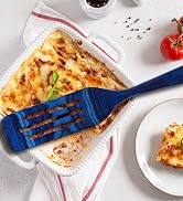 colorful wooden spurtle spatula serving lasagna