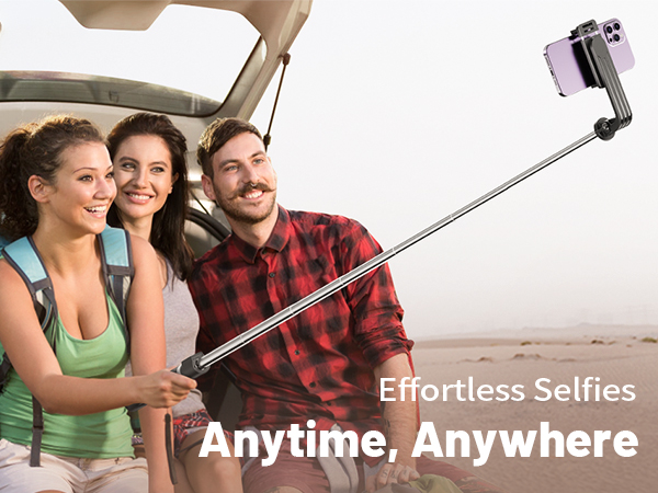 Extendable selfie stick holding a smartphone, demonstrating its use for group photos. The product is shown fully extended with a phone attached at the end.