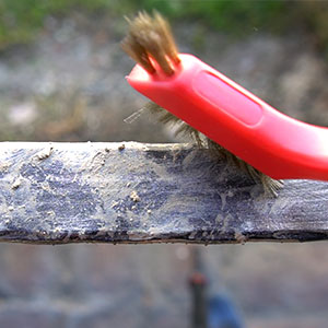 Brass brush cleaning metal parts