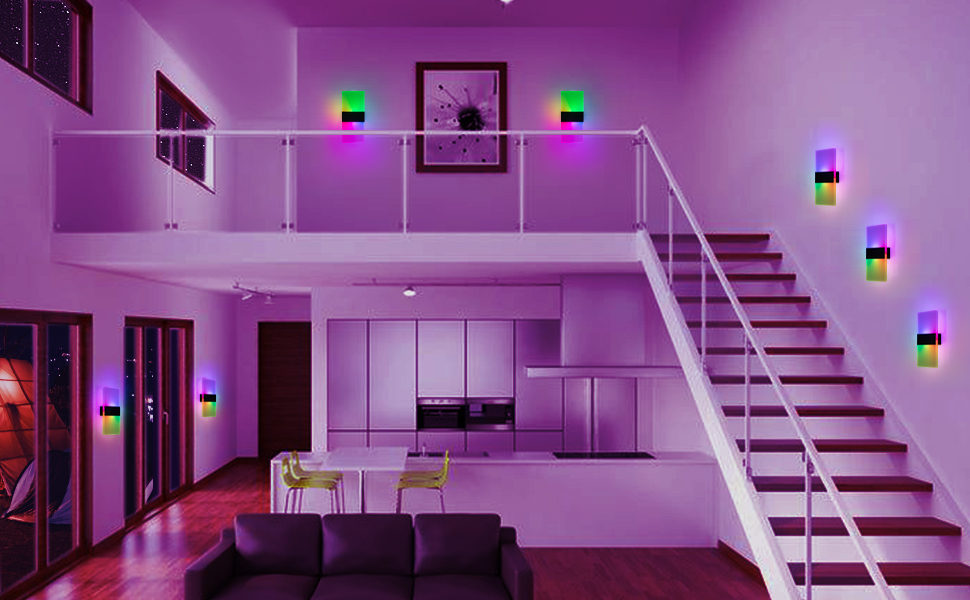 Modern interior with purple lighting. Staircase leads to upper level. Multiple wall-mounted lights with green and blue accents illuminate the space.