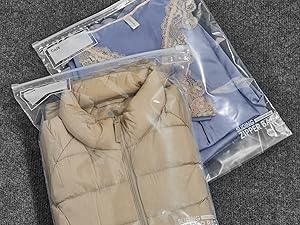 Showing how much can fit in a slider big bag by storing away seasonal clothes
