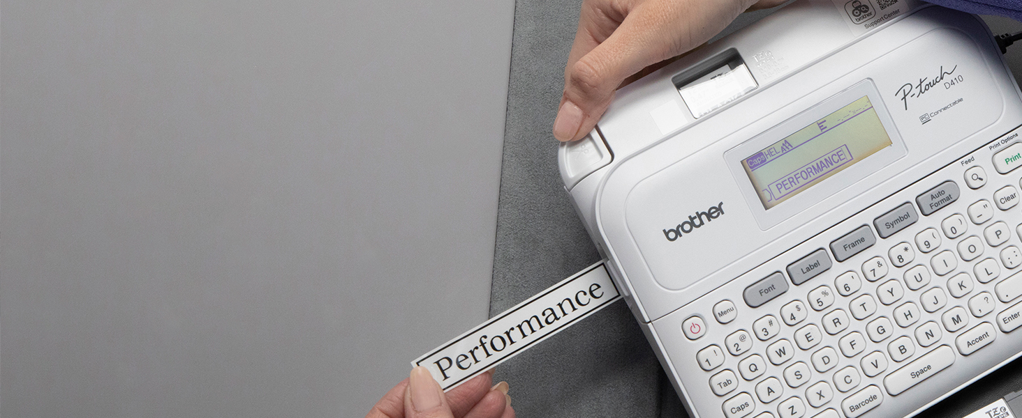 Woman in office printing label from PTD410 label maker